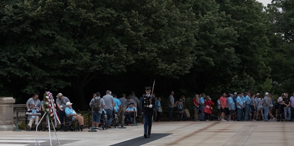 Group of veterans gathered outdoors during a commemorative ceremony.