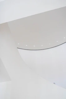 An international project stand with bold graphics and clean white surfaces under soft lighting.