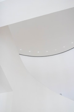 A sleek architectural model illuminated by soft, ambient lighting highlighting clean lines.