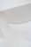 Curved architectural structures with a smooth, white surface create a minimalist aesthetic. Subtle lighting adds a soft glow to the design.