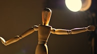 Abstract black mannequin with artistic lighting highlighting its curves.