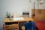 a bed room with a bed a desk and a radio