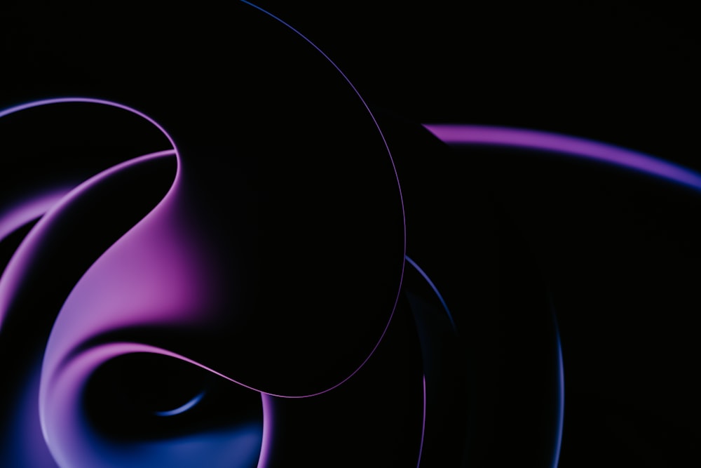a dark background with a blue and purple swirl