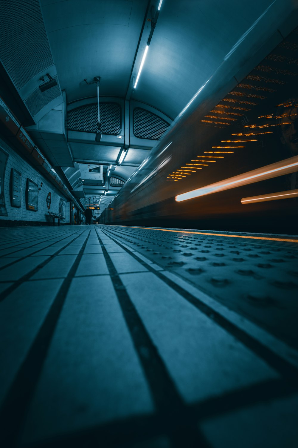 a long exposure photo of a subway station