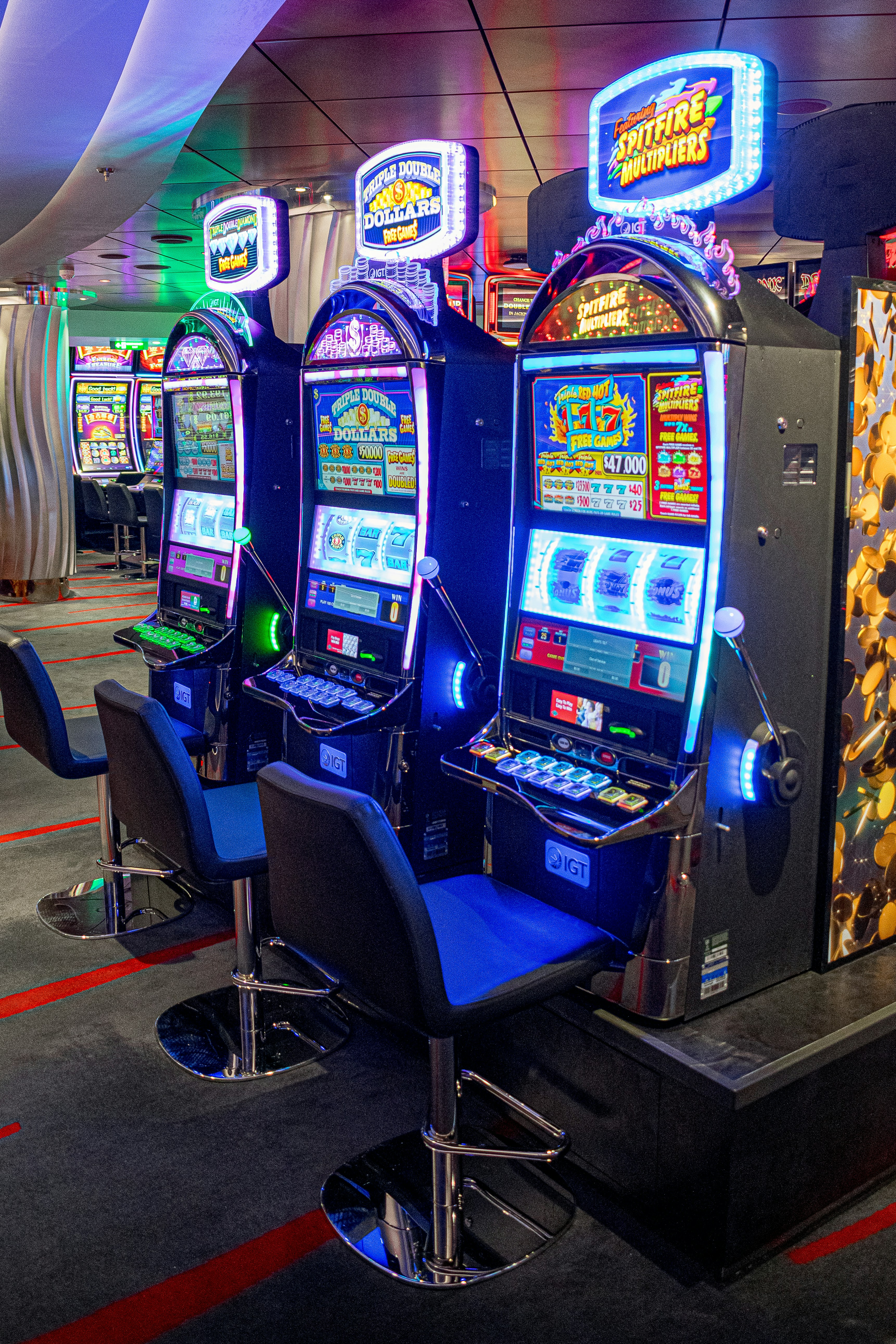 a row of slot machines sitting next to each other