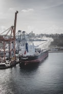 A cargo ship docked at a busy port.