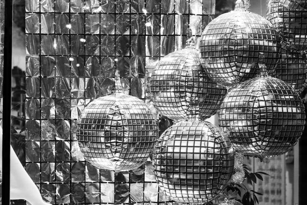 a black and white photo of disco balls
