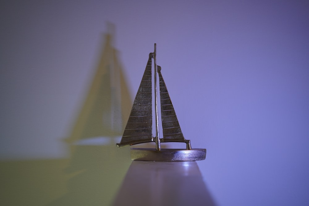 a small toy sailboat on a table