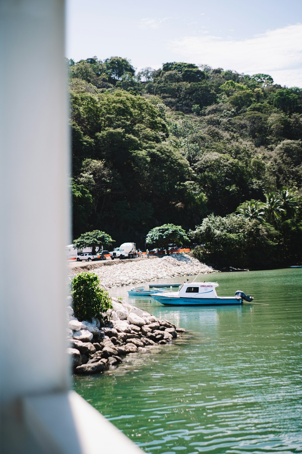 a small boat floating on top of a body of water