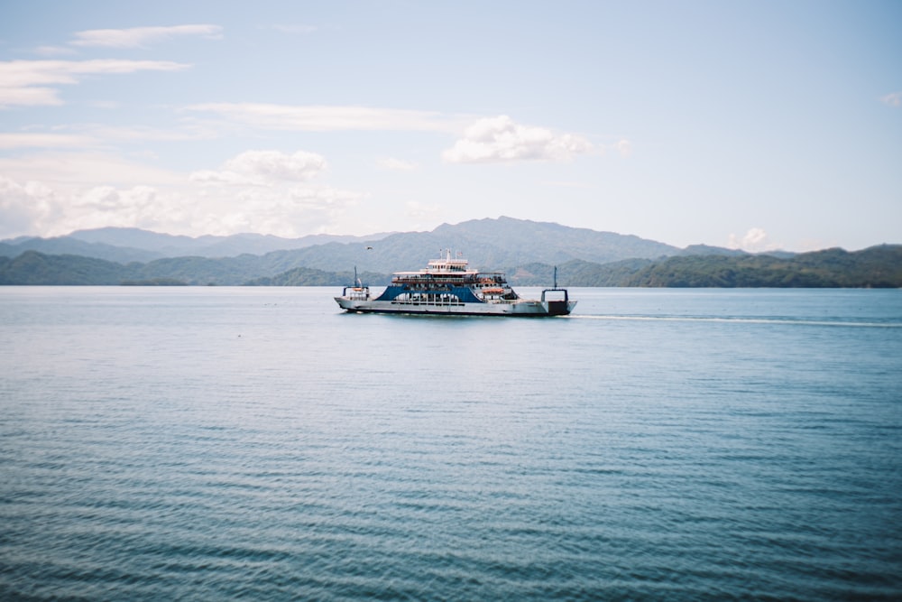 a large boat floating on top of a large body of water