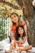 A warm scene of a mentor and teen girl sharing a heartfelt conversation outdoors.