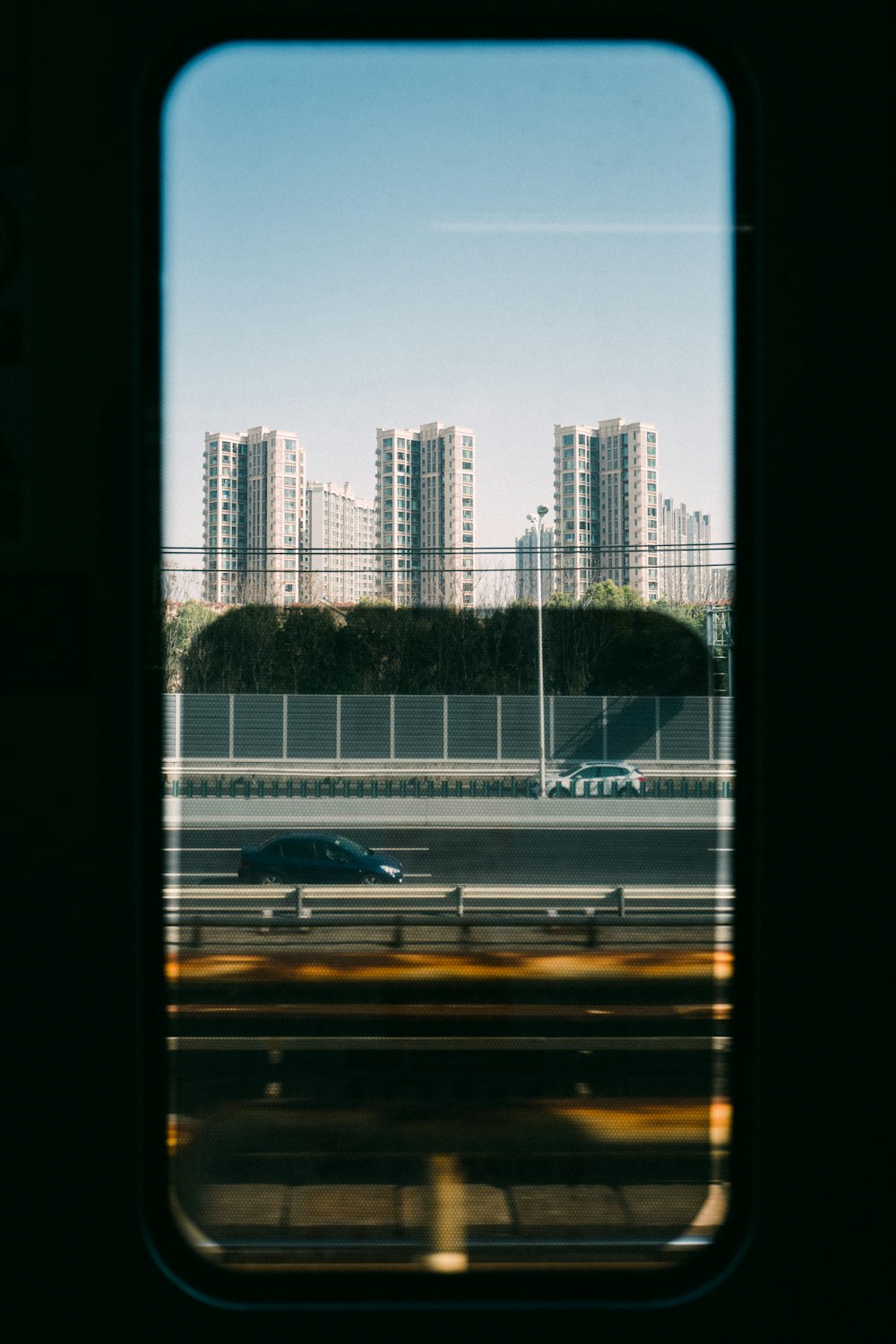 a view of a city from a train window