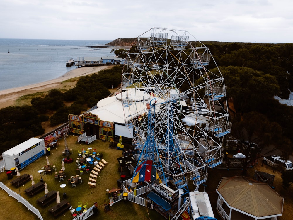 an aerial view of an amusement park with a ferris wheel