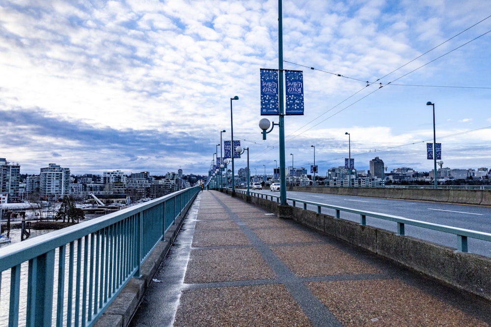 a bridge with a street sign on the side of it