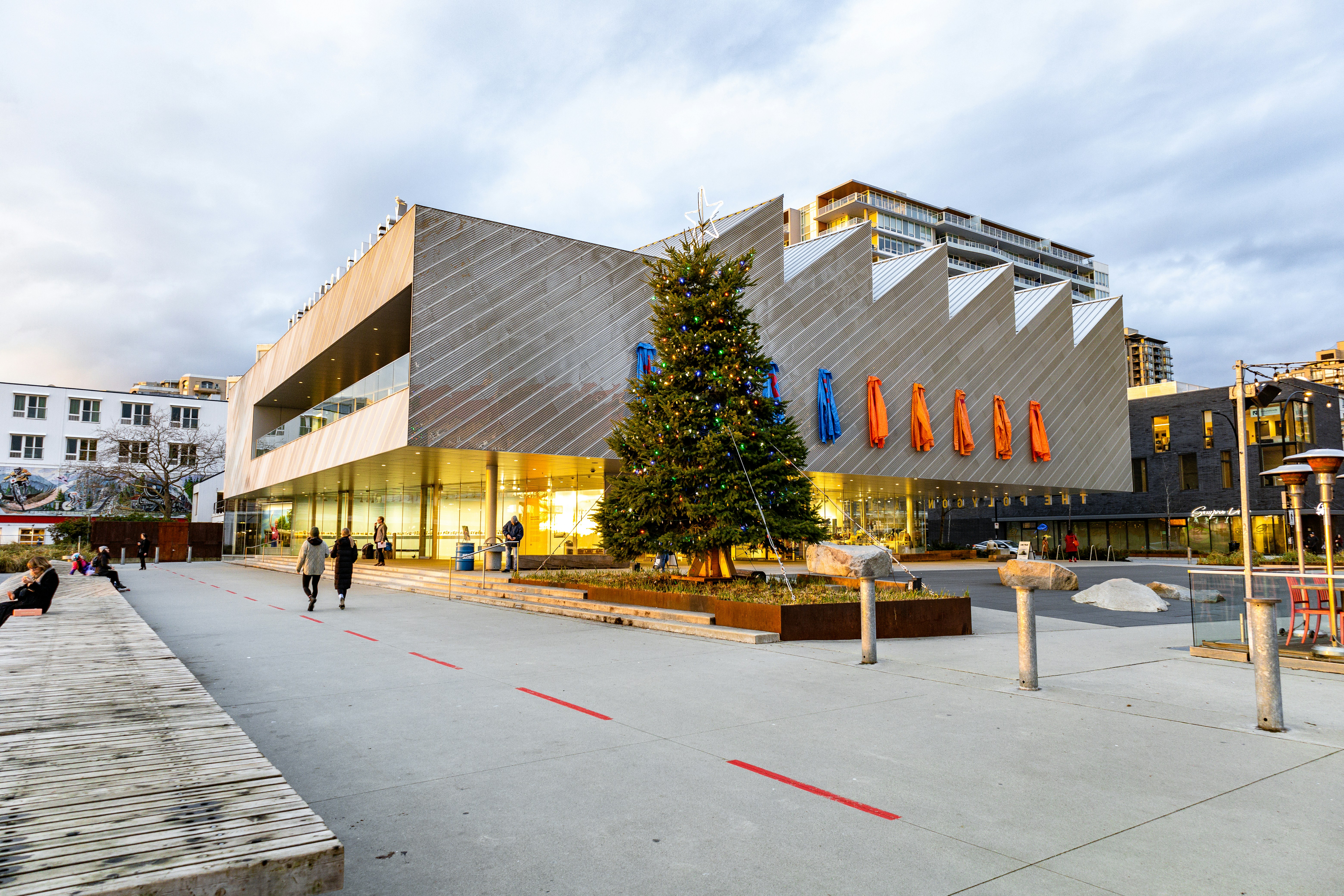 a large building with a christmas tree in front of it