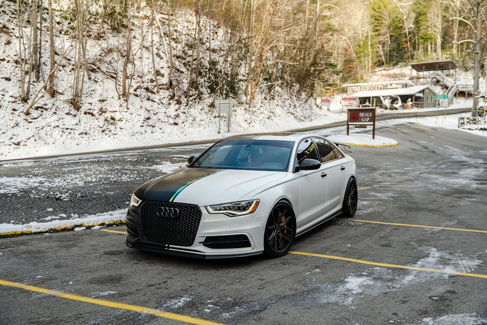 a white car parked in a parking lot