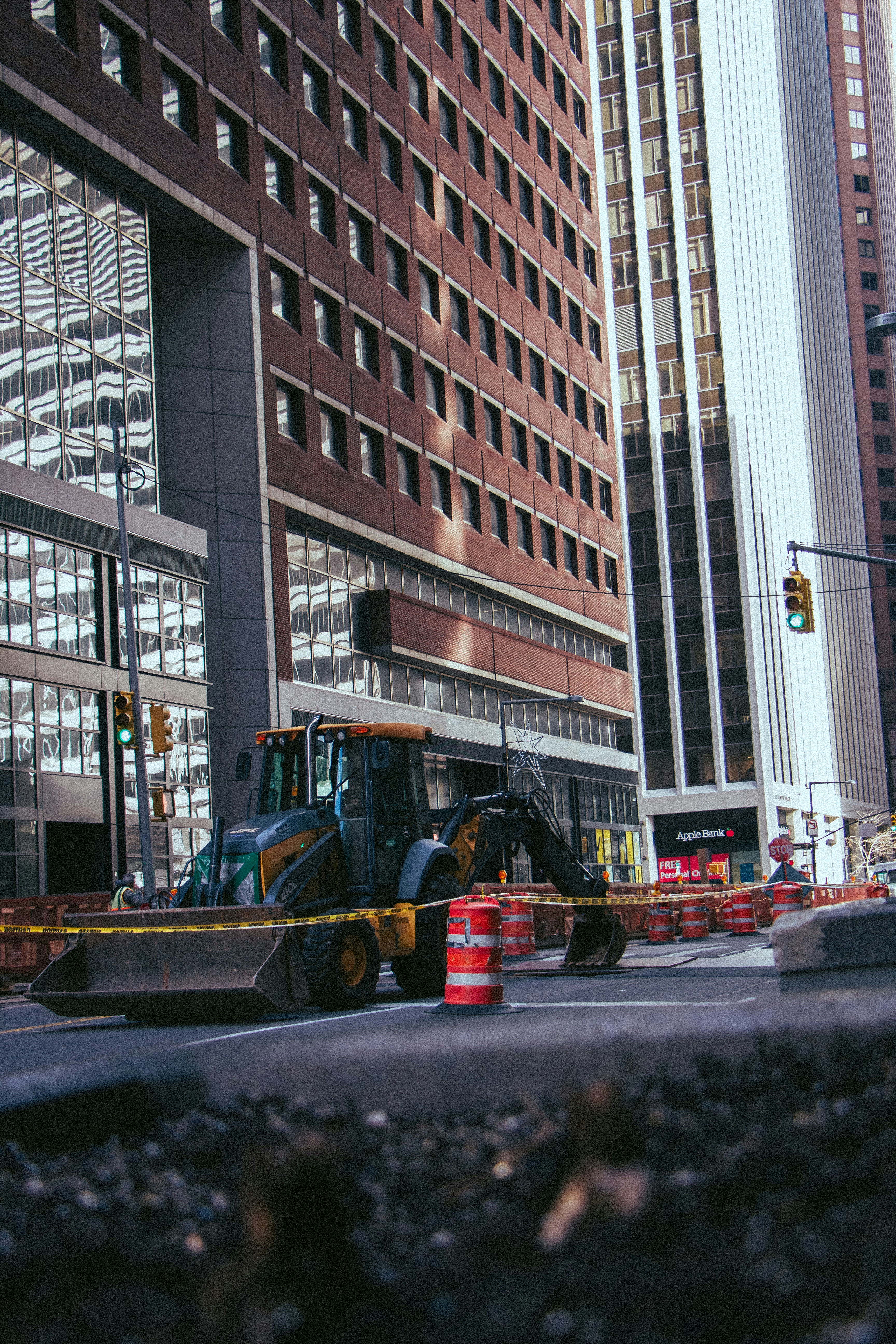 a bulldozer is parked in front of a construction site