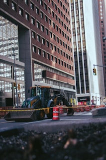 a bulldozer is parked in front of a construction site