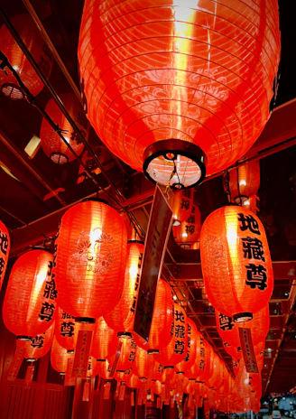 A warm family reunion celebrating traditional customs under red lanterns.