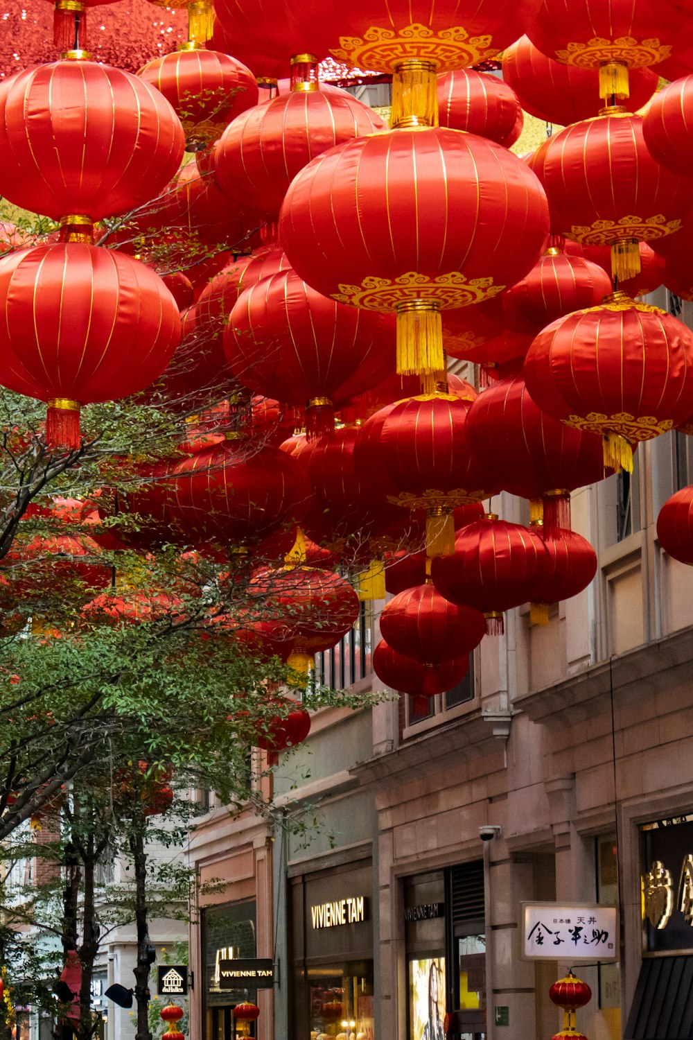 a street filled with lots of red lanterns