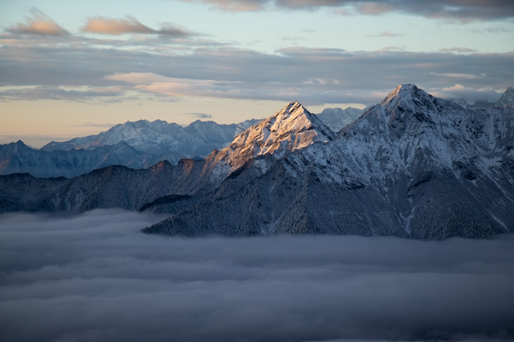 a view of a mountain covered in clouds