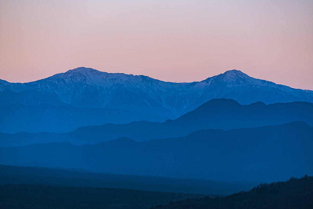 a view of a mountain range at dusk