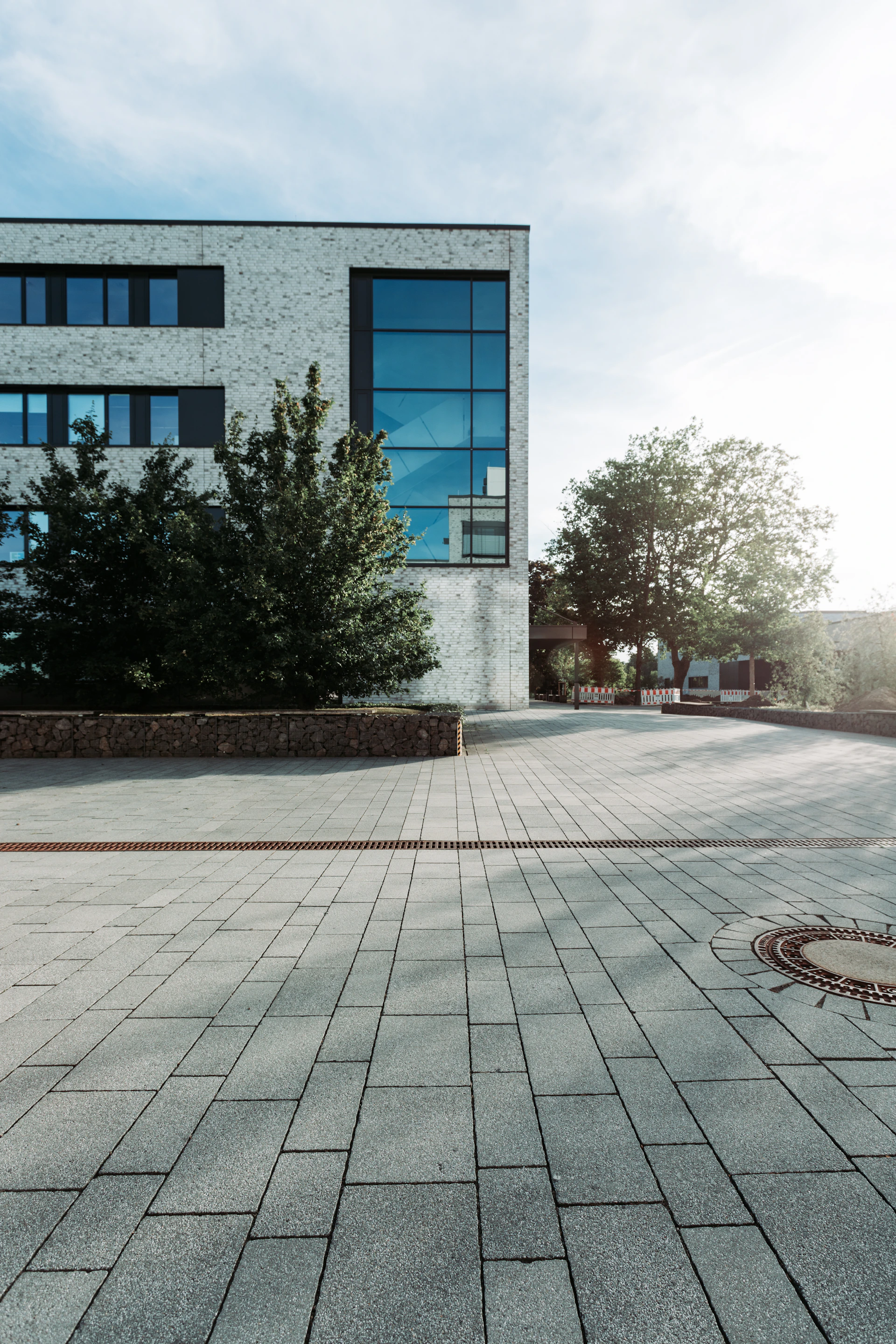 an empty street with a building in the background