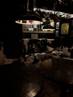 A cozy corner of the club decorated with colorful lights and laughter-themed posters