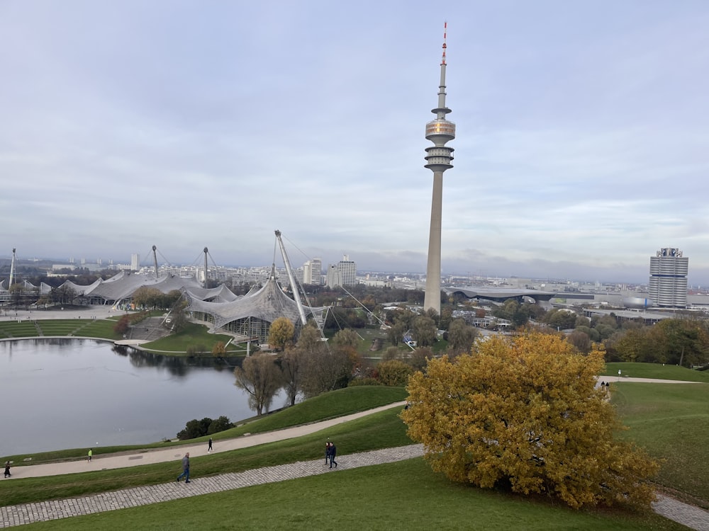 a view of a city with a lake in the foreground