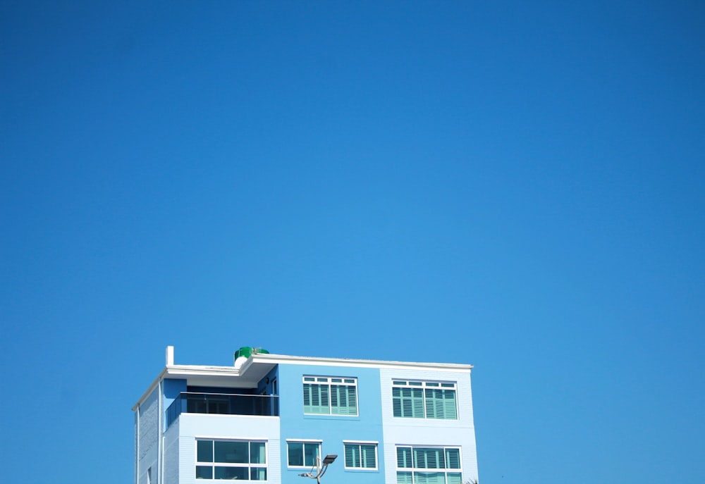 a blue and white building on a clear day