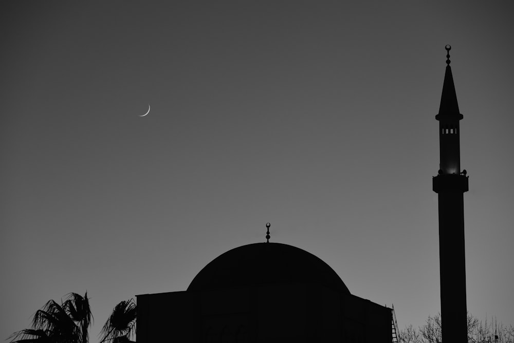 a black and white photo of a building and a crescent