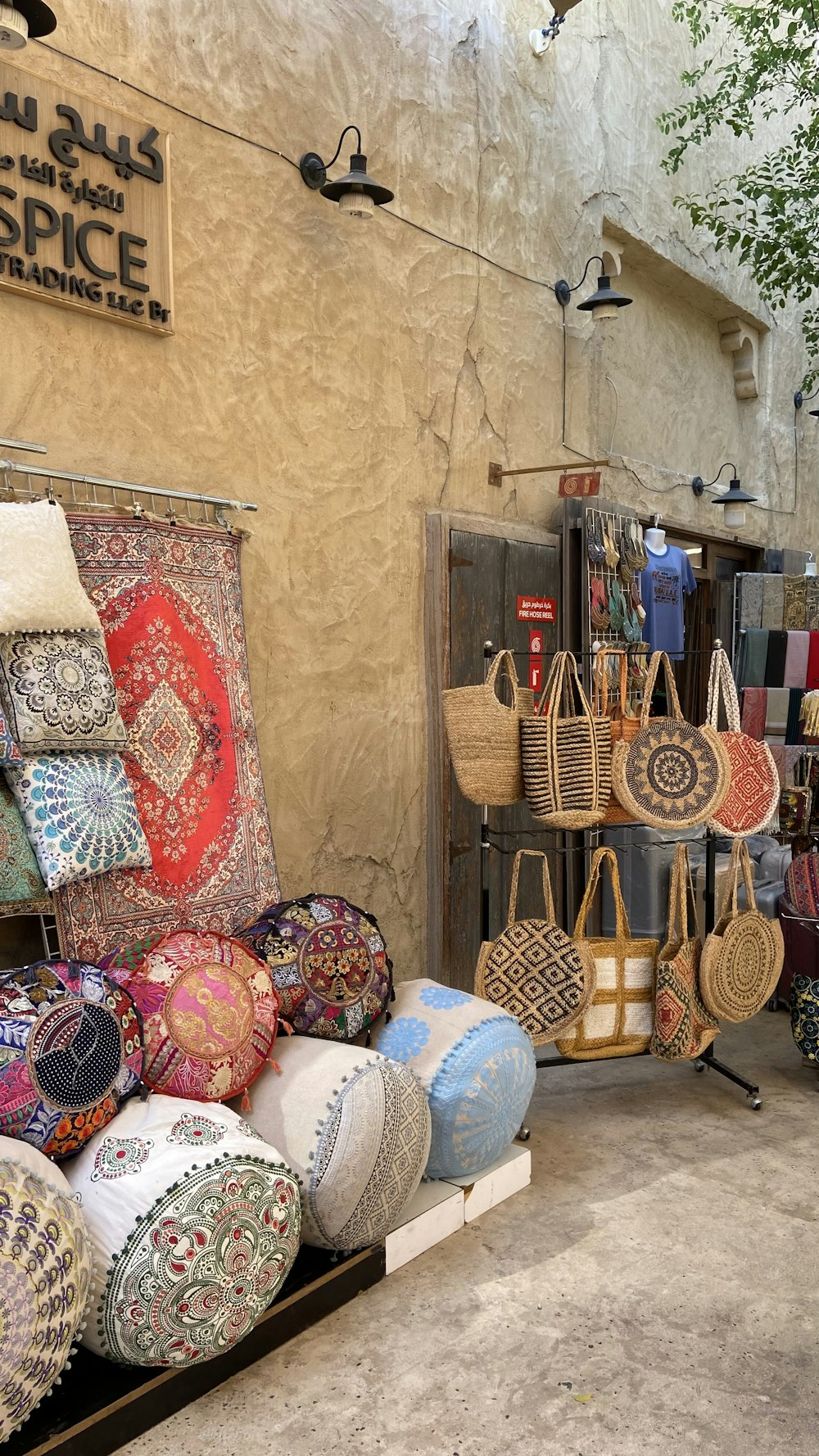 a store with a lot of bags and purses on display