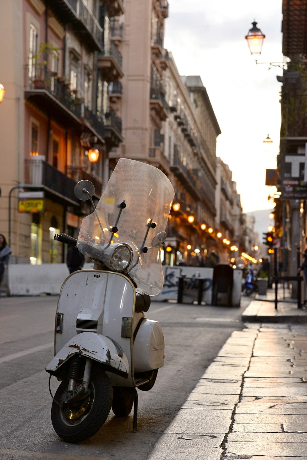 a scooter parked on the side of the road