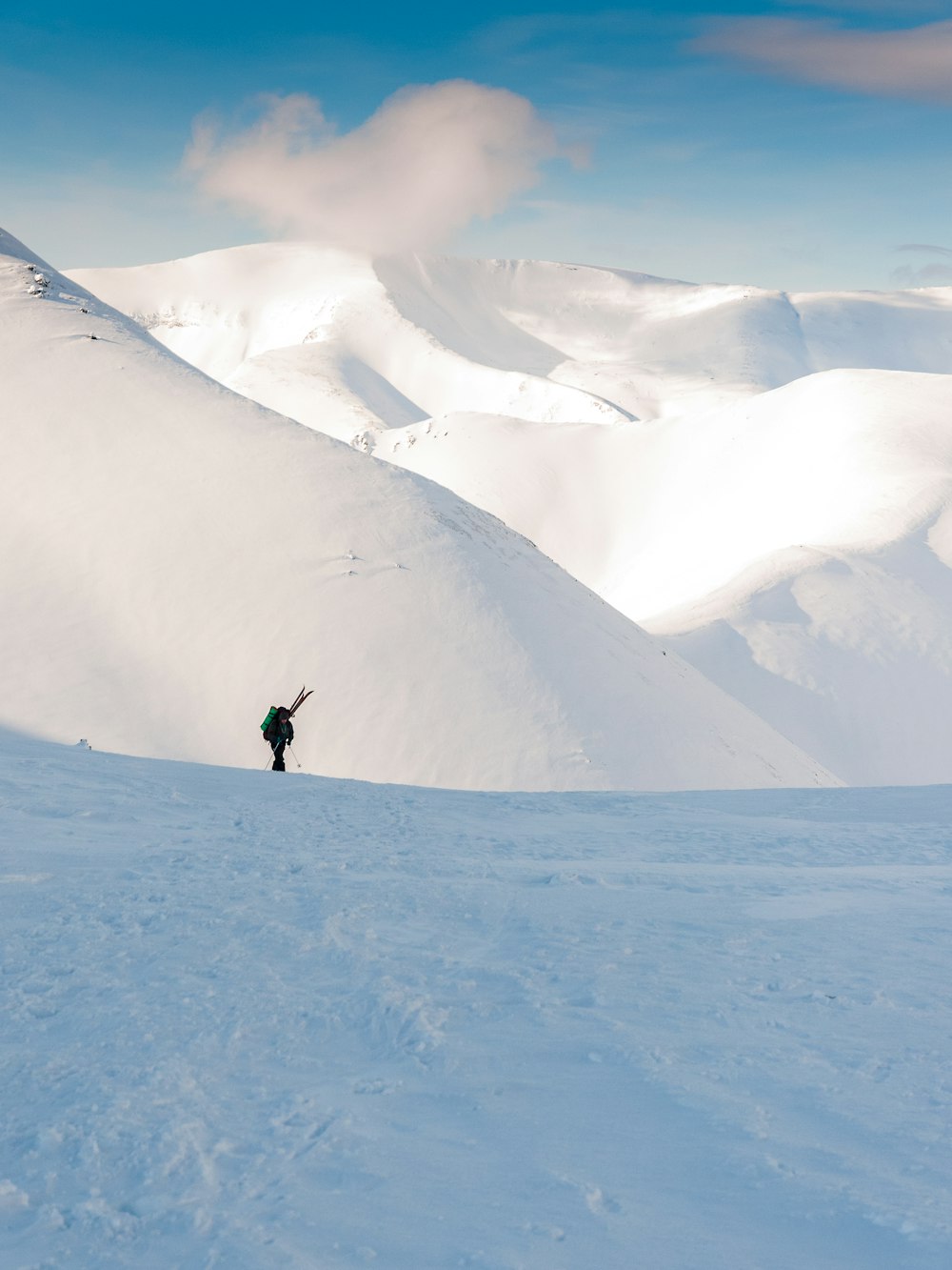 a person skiing down a snow covered mountain