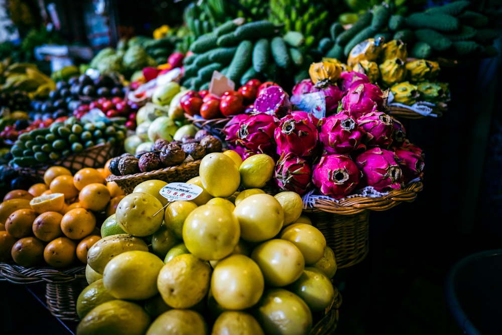 a variety of fruits and vegetables on display at a market