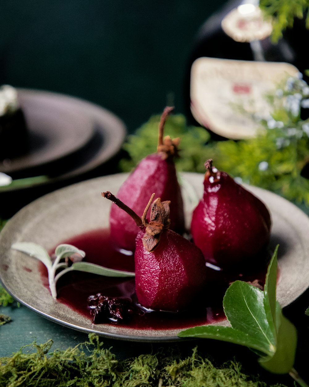 a plate with three pears on it