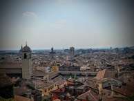 A panoramic view of a historic European city with cobblestone streets and old architecture.