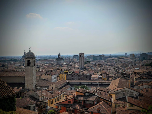 A panoramic view of a historic European city with cobblestone streets and ancient buildings.