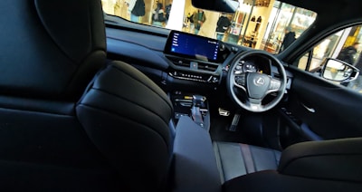 Interior shot of a Lexus LX 600 showing luxurious leather seats and advanced dashboard.
