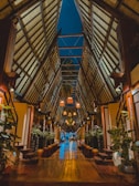 the inside of a building with a wooden floor