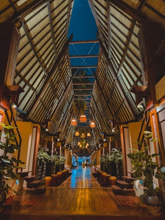 the inside of a building with a wooden floor