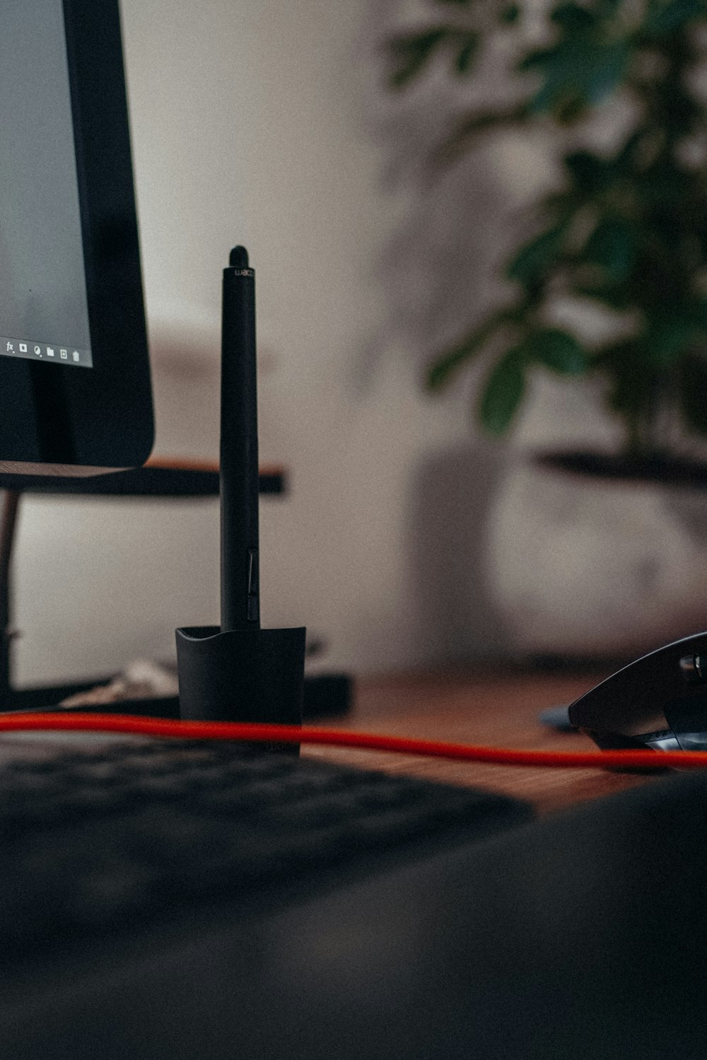 a desk with a keyboard, mouse and a monitor