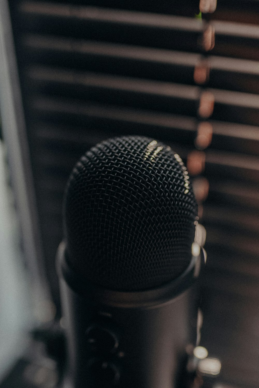 a black microphone sitting on top of a table