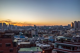 An aerial view of a mixed-use commercial real estate development project at sunset.
