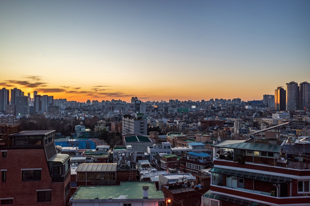 a view of a city skyline at sunset