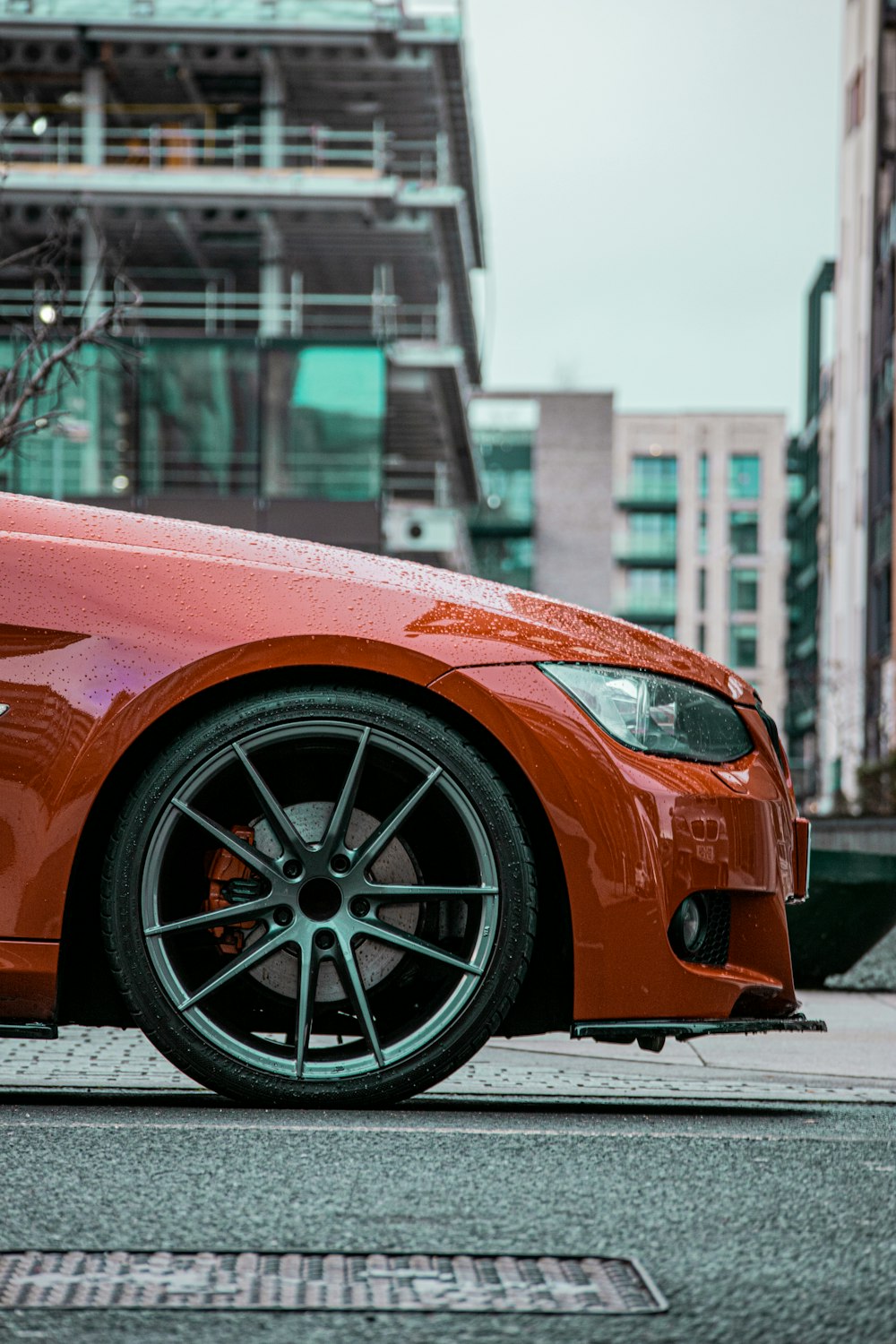 a red car parked on the side of the road