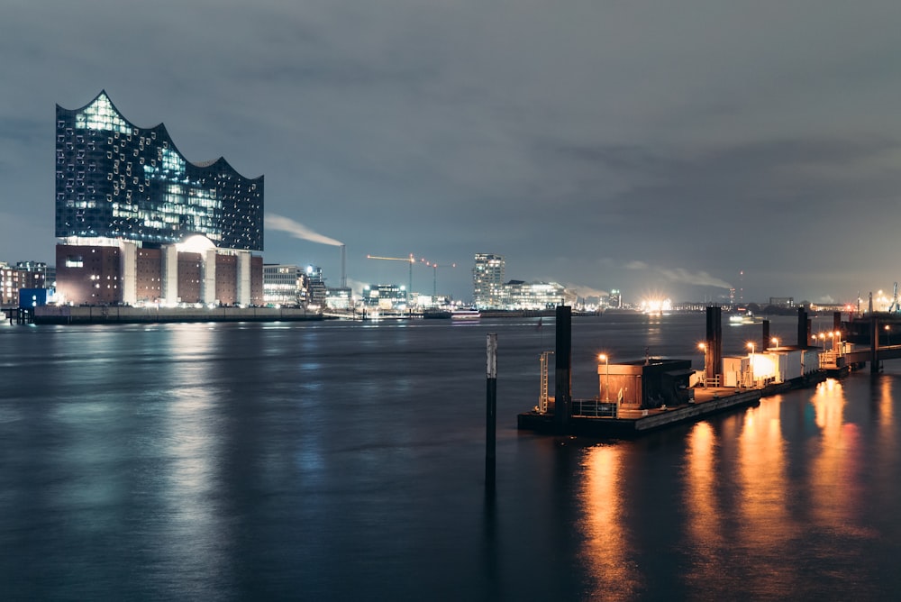 a large body of water with a city in the background