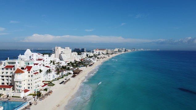 an aerial view of a beach and a city