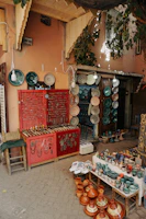 a store with lots of pottery and plates on display