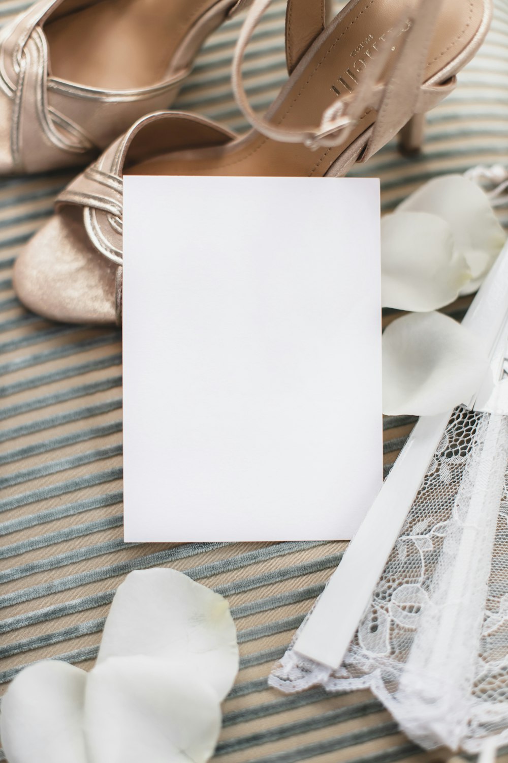 a pair of shoes and a card on a table